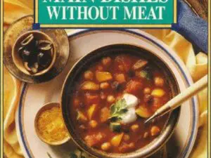 Bowl of vegetable soup on cookbook cover