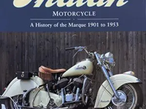 Classic cream Indian motorcycle parked against fence