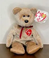 Beige teddy bear with red heart patch