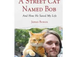 Book cover: orange cat on man's shoulder