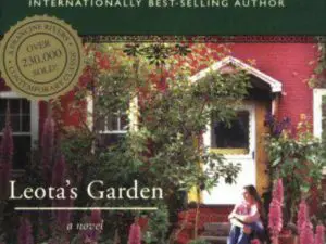 Woman on porch amid pink garden flowers
