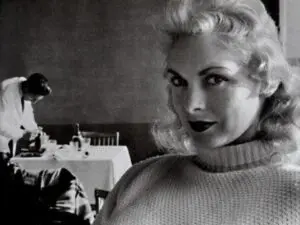 Black-and-white portrait of glamorous blonde woman