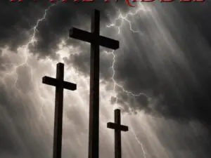 Three crosses on hill with stormy sky