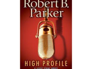 Gold vintage microphone on red book cover