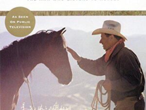 Man in cowboy hat petting horse outdoors