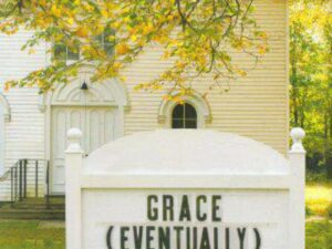 White church with sign reading GRACE (EVENTUALLY)