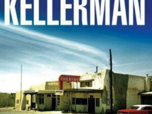 Desert roadside theater with parked red car