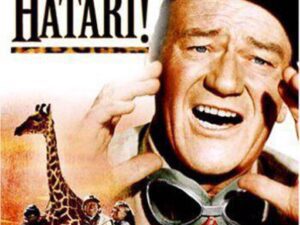 Hatari! movie poster featuring smiling man, giraffe