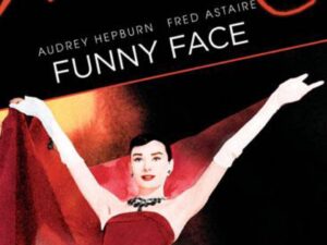 Woman in red gown on vintage movie poster