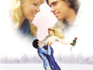 Couple smiling above ice-skating lift with rose