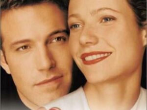 Close-up of smiling couple on movie poster
