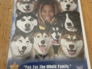 Snow Dogs DVD cover: man surrounded by huskies