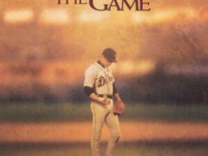 Baseball pitcher standing on mound at sunset
