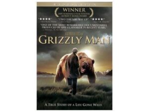 Movie poster: man walking with grizzly bear