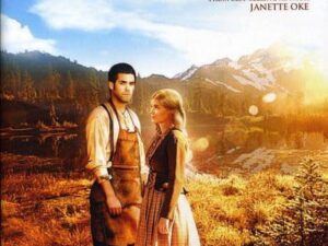 Couple standing in rustic field at sunset
